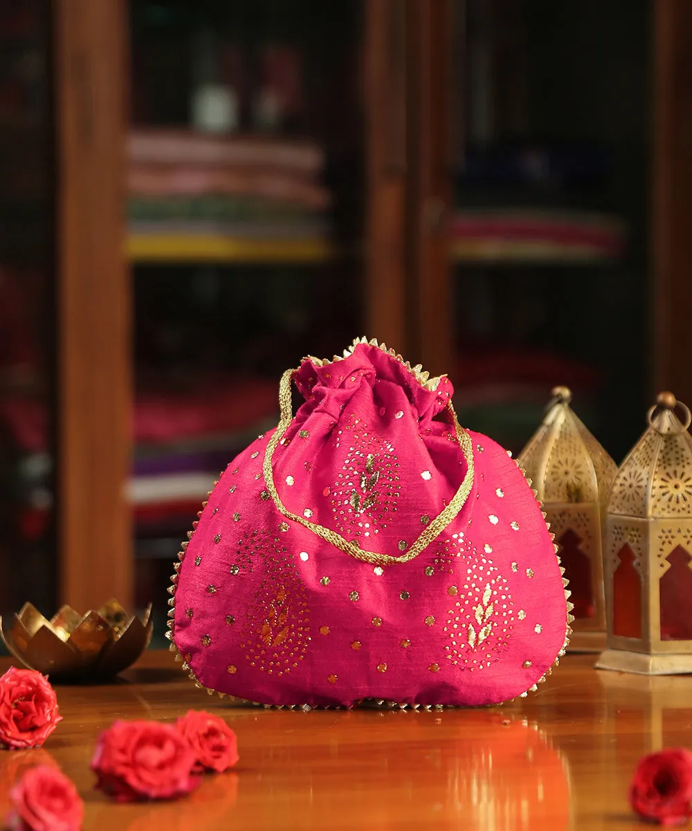 Magenta Pink Raw Silk Potli With Mukaish Hand Embroidery And Paisley Design