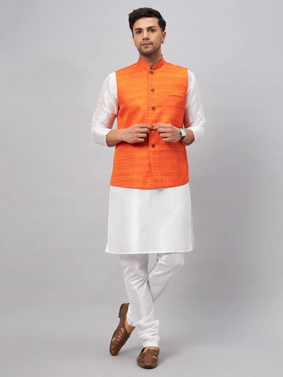 VM BY VASTRAMAY Men's Orange Matka Silk Nehru Jacket With White Silk Blend Kurta Pyjama Set